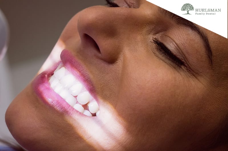 close up petient lying down with light focused on teeth