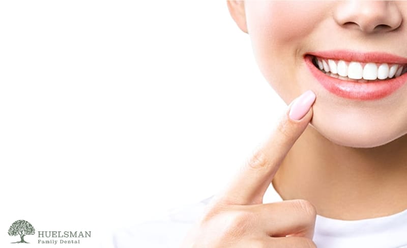 woman pointing her teeth